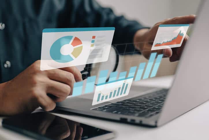 A digital marketing professional managing pay-per-click campaigns on his laptop