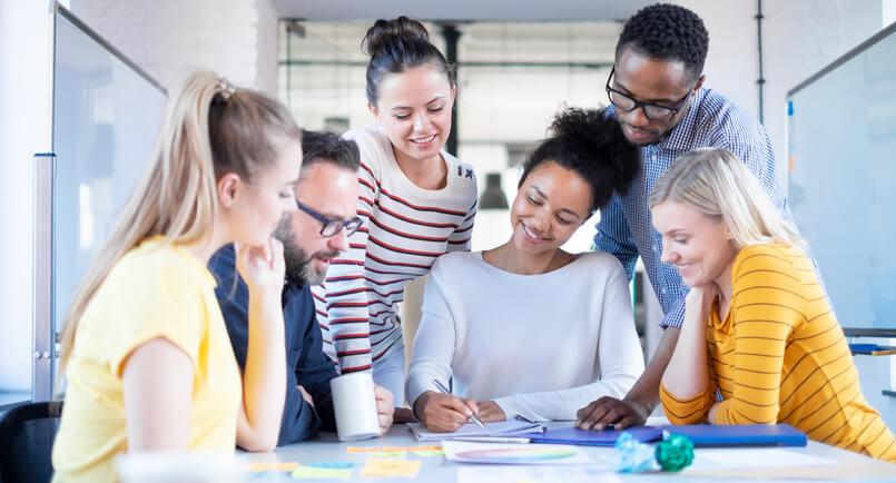 A team of marketers strategizing a social search marketing plan
