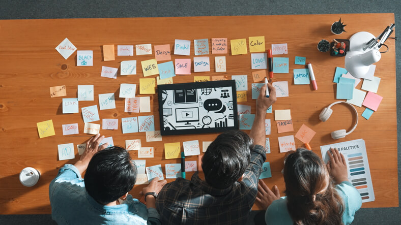 A team brainstorming solutions to content marketing challenges.