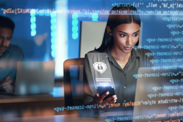 A student learning cybersecurity concepts on a computer during a training course in BC.