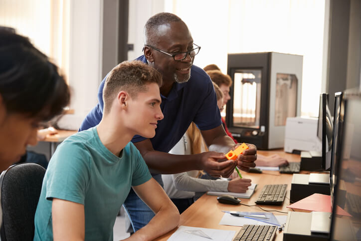 An instructor teaching cybersecurity fundamentals in a classroom at Cumberland College BC.