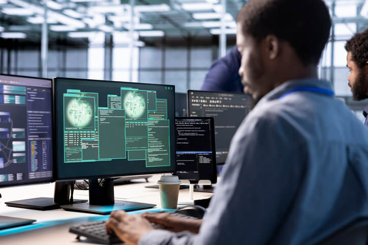 A cybersecurity student analyzing network security threats in a classroom setting