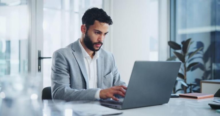 A digital marketer reviewing AI-generated content for accuracy, showing an example of the disadvantages of ChatGPT