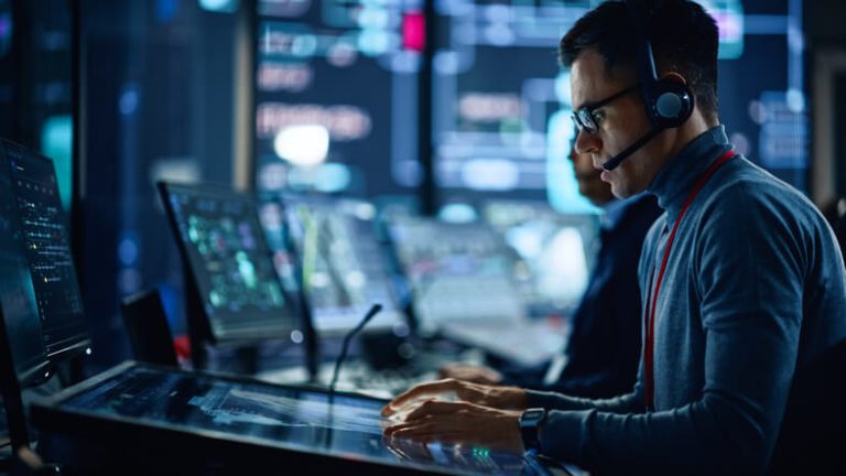 An SOC analyst monitoring cybersecurity alerts in the security operations center