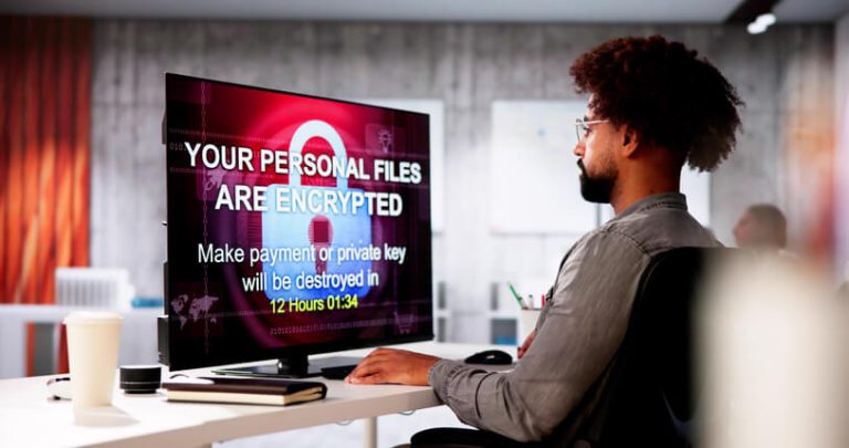 A computer screen displaying a ransomware warning message