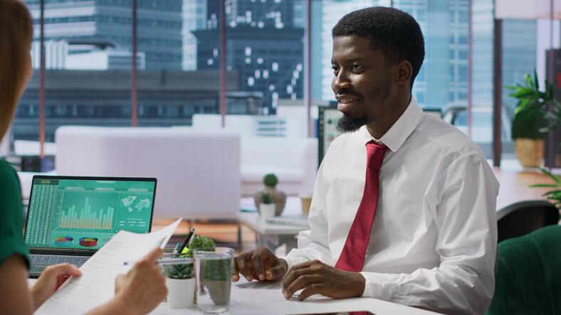 A hiring manager conducting cybersecurity interview questions with an entry-level applicant