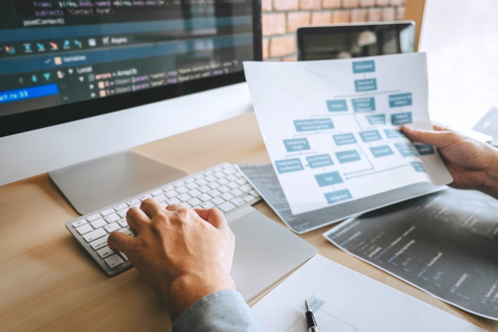 A digital marketing professional reviewing website tags and landing page code