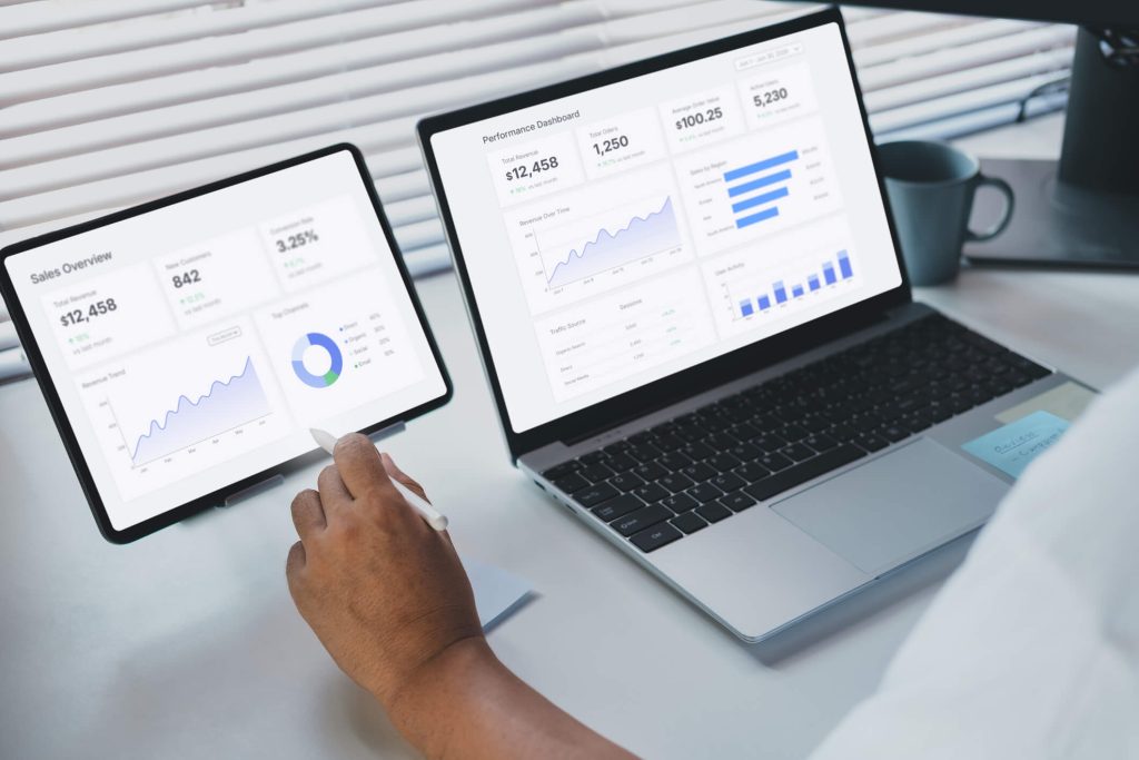 Marketing professional analyzing website performance using GA4 dashboards.