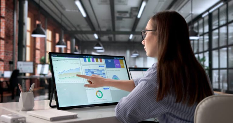 Student analyzing business dashboards using AI-powered analytics software