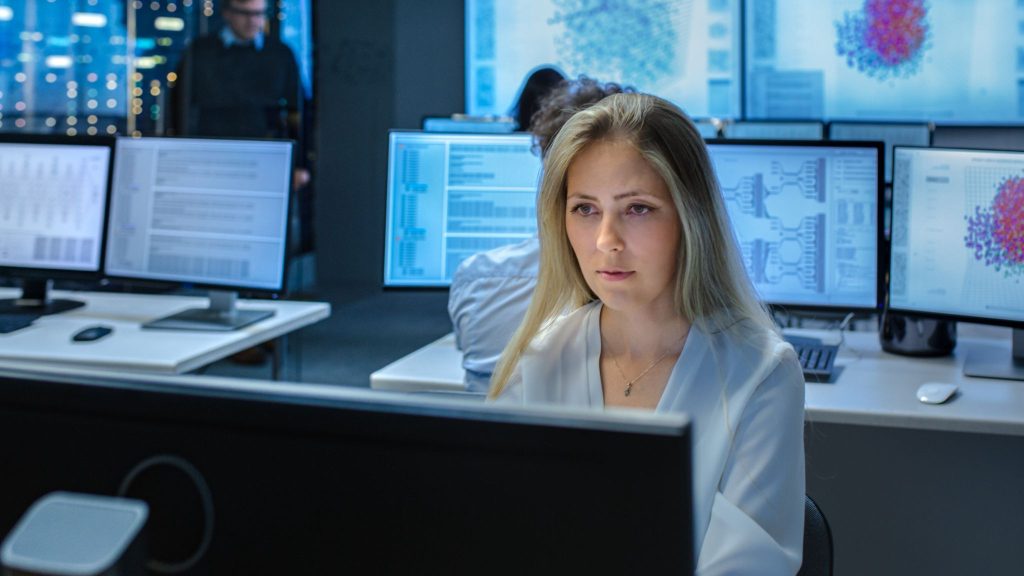 Student training in a cybersecurity lab while considering Canadian Armed Forces paid education