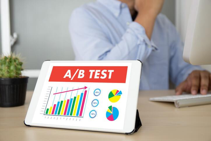 A digital marketing student reviewing A/B testing results on a computer