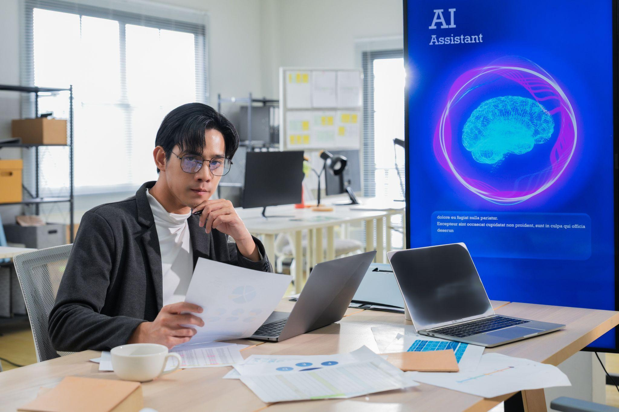 A business manager reviewing an AI-assisted report before making a decision